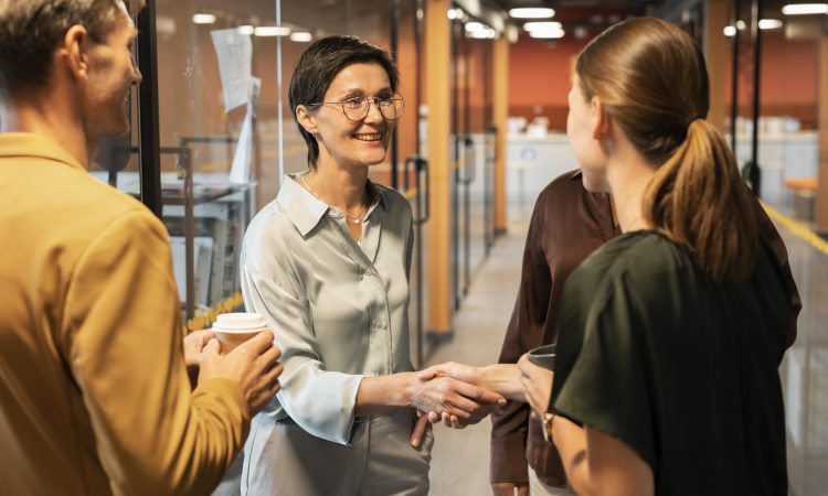 close-up-women-shaking-hands-work