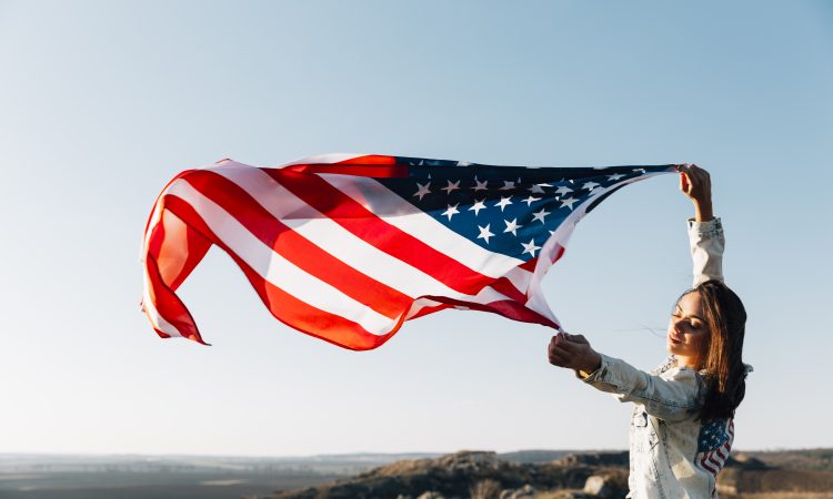 beautiful-patriotic-woman-with-fluttering-american-flags