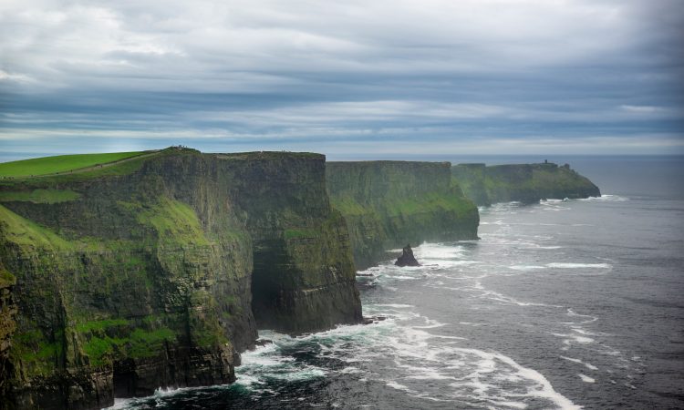 A beautiful view of the cliffs of Moher in Ireland on a gloomy day background