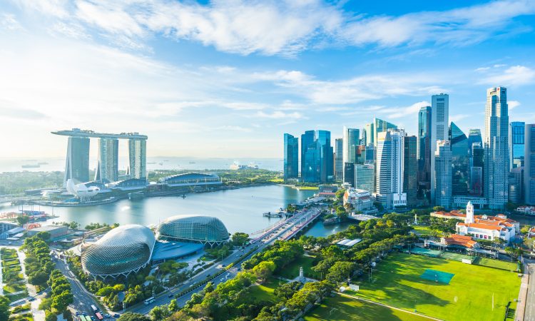 Beautiful architecture building exterior cityscape in Singapore city skyline with white cloud on blue sky