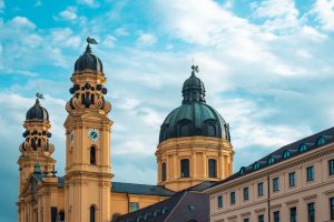 theatine-church-sunlight-cloudy-sky-munich-germany