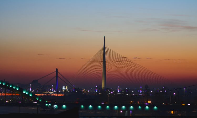 Ada bridge on Sava river at sunset. Modern design and architecture.