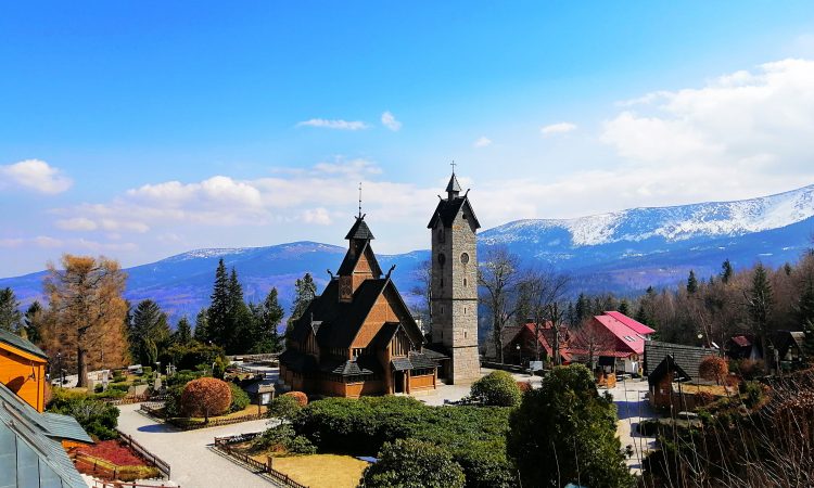 A beautiful shot of Wang Church and a tower in Karpacz, Poland