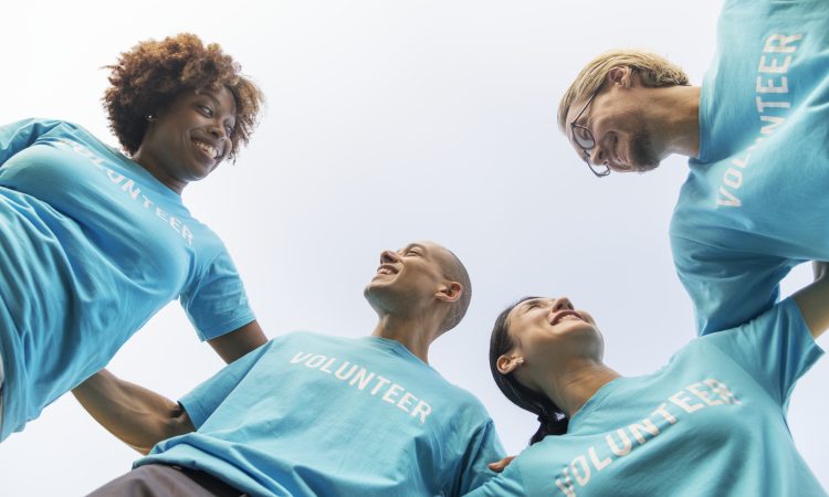 Group of happy and diverse volunteers