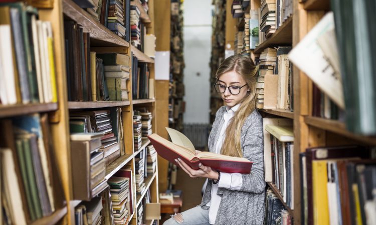 student-reading-book-bookcases (1)